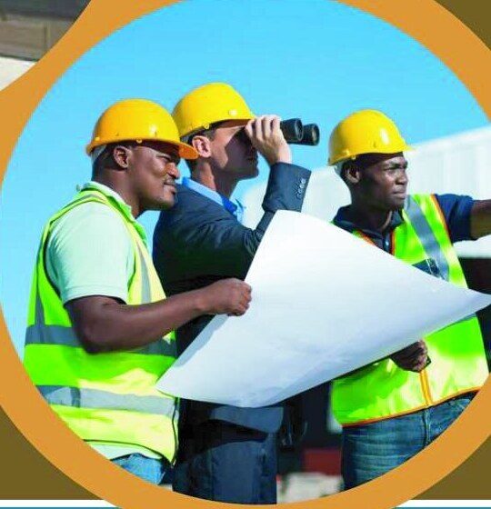 Boliville site team reviewing drawings with binoculars on site