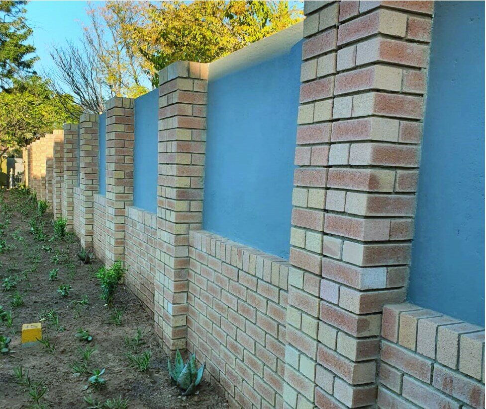 Face-brick boundary wall with panels